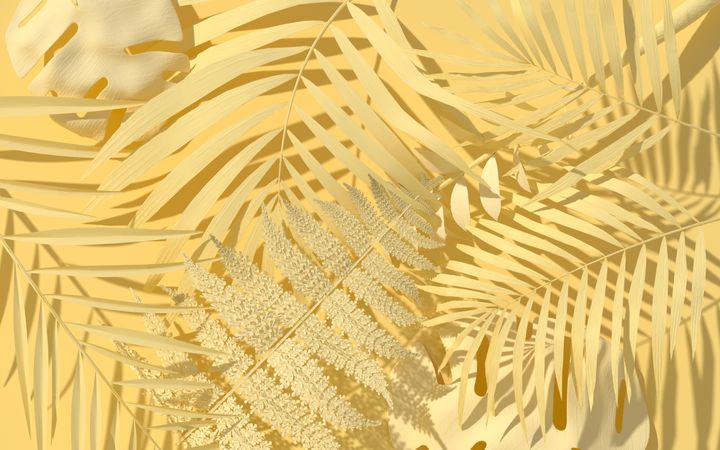Yellow background with yellow painted palm and monstera leaves