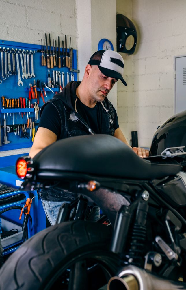 Mechanic checking motorcycle