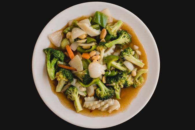 Cooked appetizing soup with squid and vegetables
