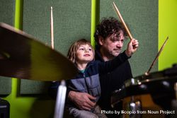 Father and son playing drums 5odMg4