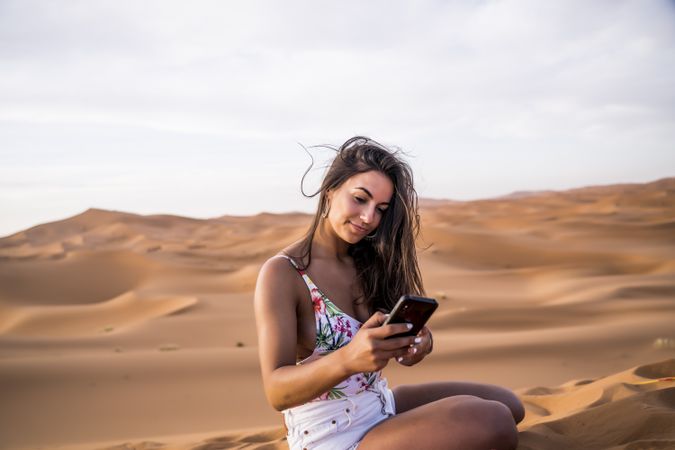 Woman taking selfie in desert
