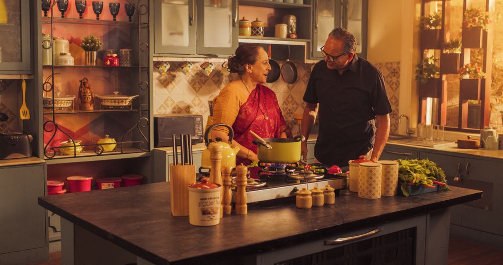 Indian Couple Exploring Traditional Cooking: Preserving Culinary Heritage, Preparing Authentic Recipes with Love and Care.