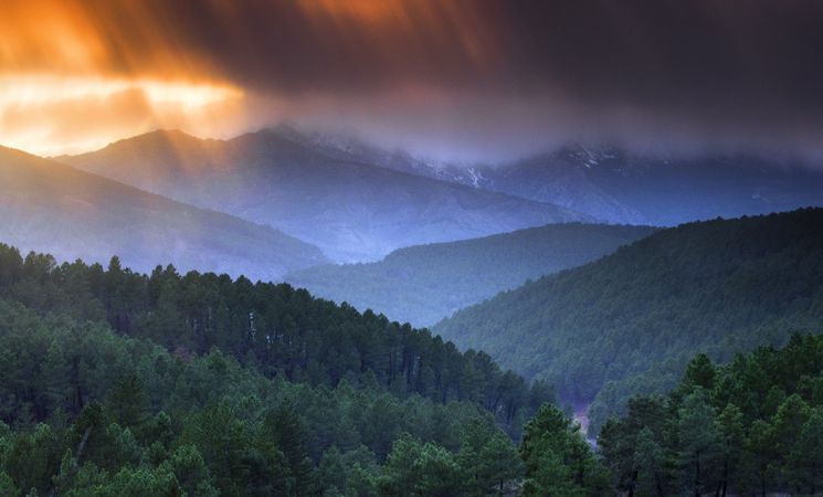 Sunset over hilly terrain