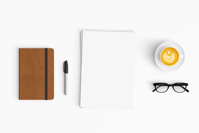 Modern workspace with coffee cup, paper, notebook and tablet copy space