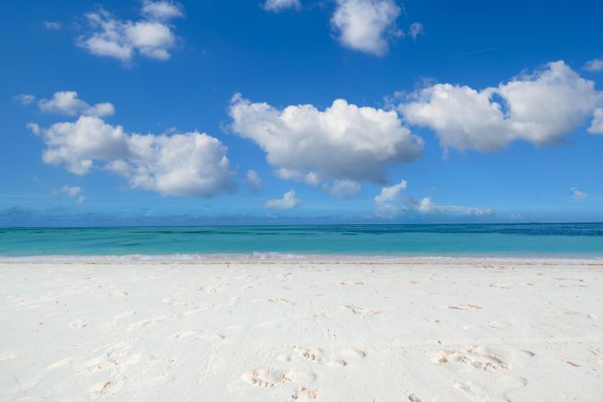 Clear beach with light sand and vast ocean