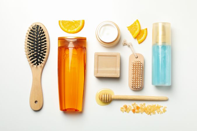 Flat lay with cosmetics and natural ingredients on light background
