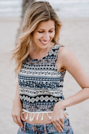 Happy female laughing on sandy beach