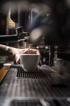 Barista using coffee machine