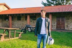 Man posing and custom motorcycle in background
