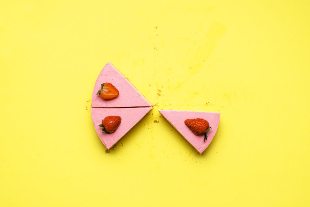 Three slices of strawberry cheesecake
