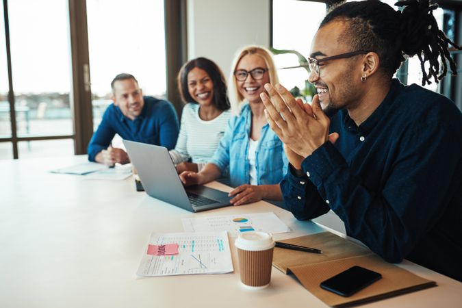 Multi-ethnic group of colleagues smiling during a meeting