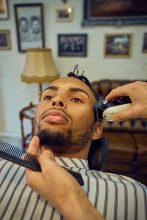 Anonymous hairstylist doing a haircut