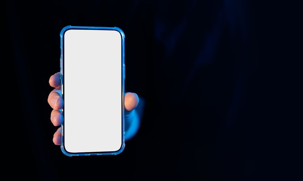 Hand holding smartphone mockup display