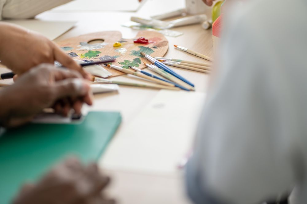 Background of paint and brushes on the table