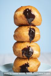 Chocolate filled doughnuts stacked 4ZkYOb