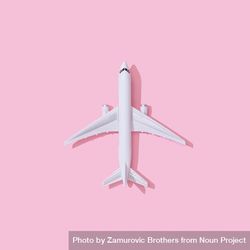 Passenger plane on pastel pink background 56NYl5