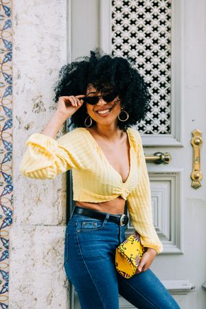 Fashionable female by gray door