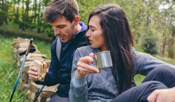 Couple pausing while doing trekking