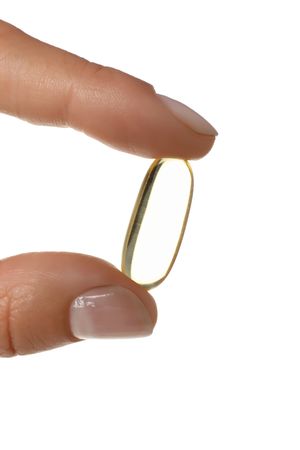 Omega pills in hand, isolated on blank background