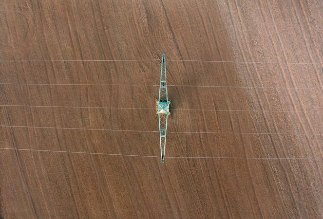 Drone shot with electricity pylon directly above