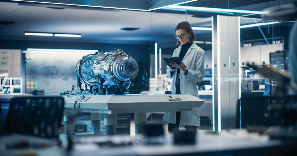 Female Scientist Developing New Electric Motor in a Research Facility