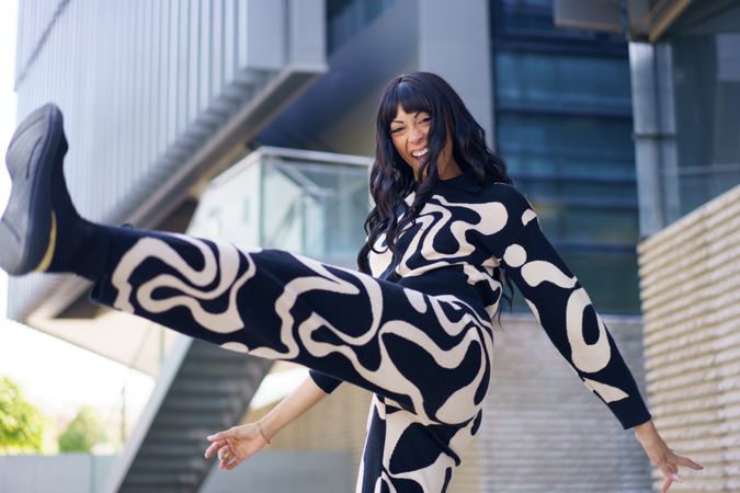 Woman dancing in the street in city