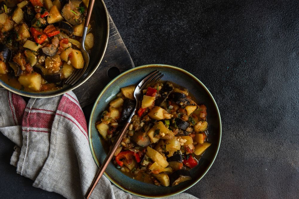Top view of Georgian summer and autumnal dish Ajapsandali with vegetables on counter with copy space