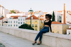 Fashionable female relaxing in city