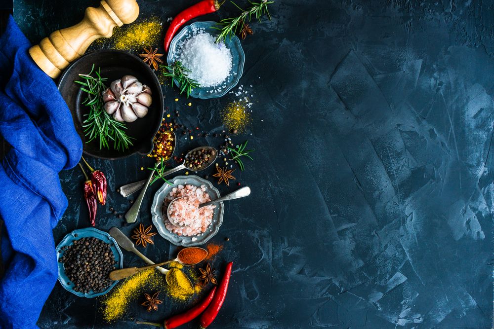 Top view of spices and salt on counter with copy space