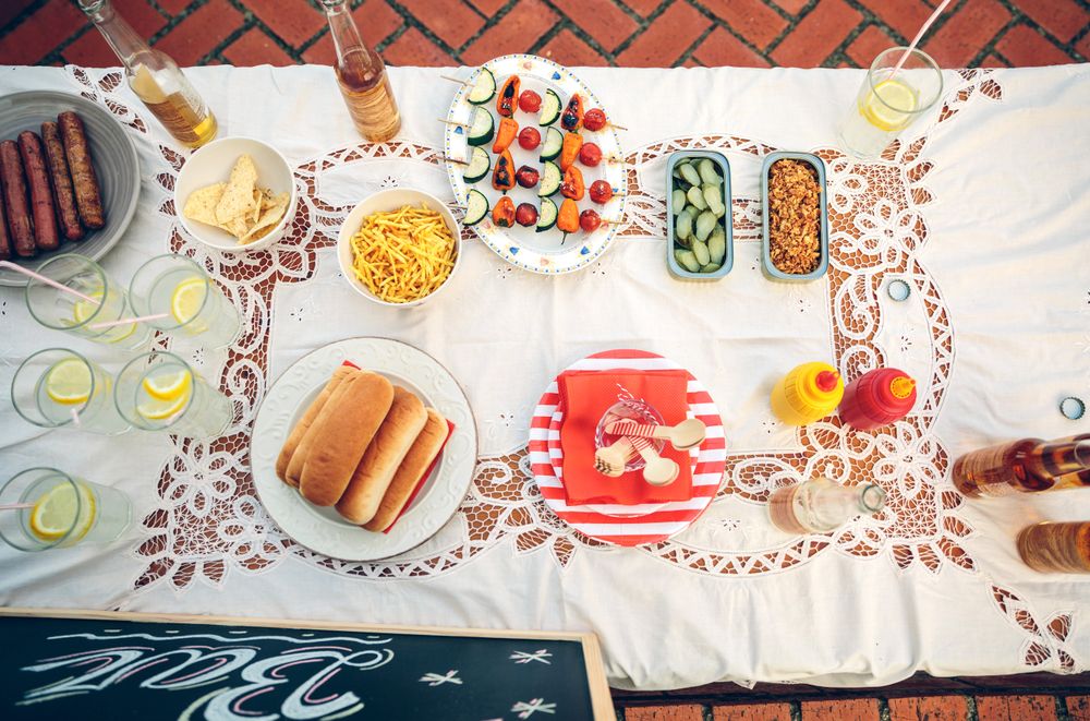 Top view of table with food and drinks at summer party