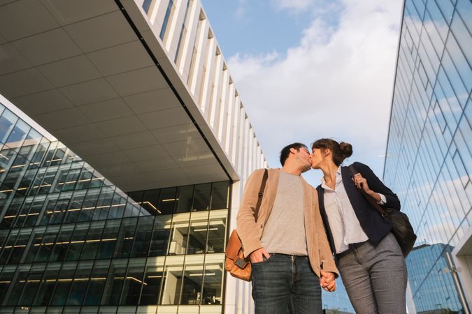 Businesspeople couple outside contemporary building