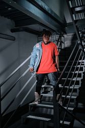 Black male standing on steps