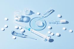 Pharmaceutical drugs on the blue background, concept of complex treatment