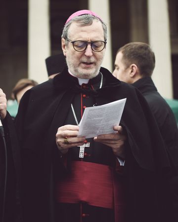 London, England, United Kingdom - March 5 2022: Catholic Bishop reading from paper outside