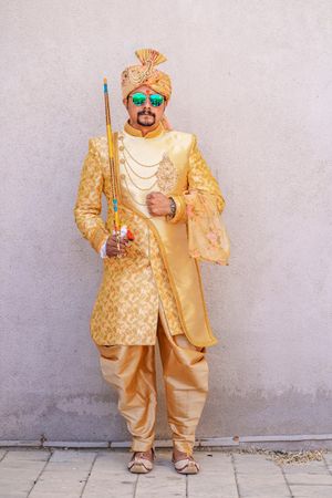 Indian man wearing traditional wedding outfit