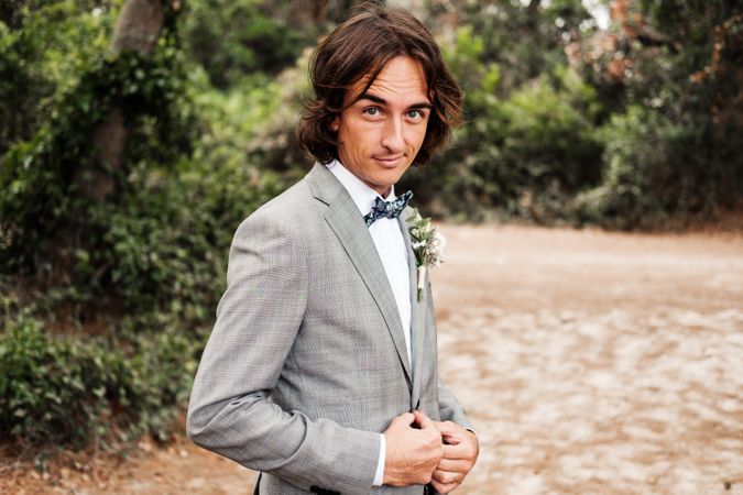 Groom walking on road at nature