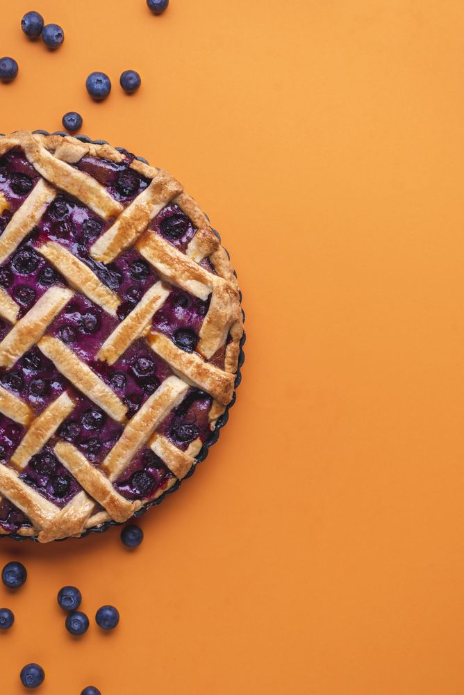Flat lay with delicious blueberries dessert
