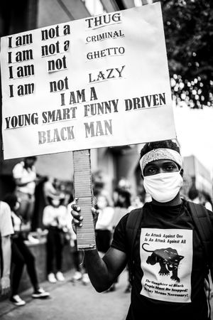 MONTREAL, QUEBEC, CANADA – June 7 2020- protester holding a sign during a black lives matter protest