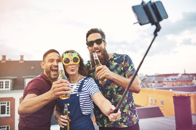 Three really happy friends taking a selfie