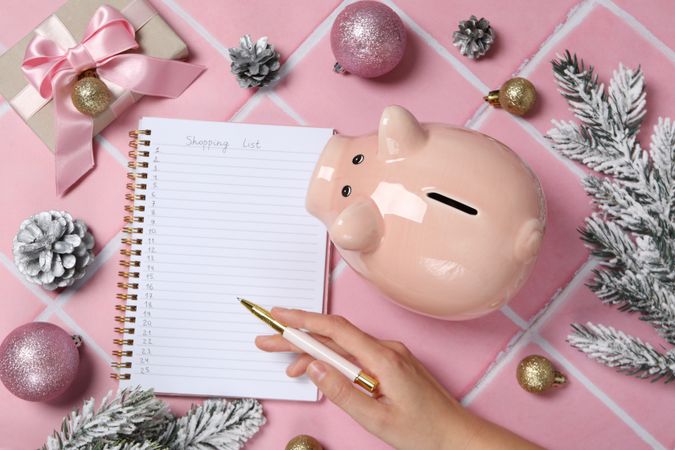 Concept of Christmas finance with piggy bank, top view