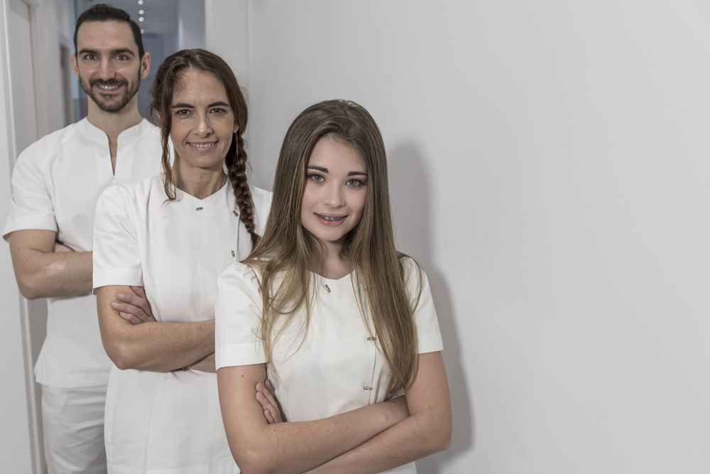 Portrait of confident group of medical staff standing in bright office