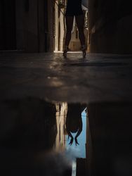 Anonymous ballet dancer near puddle