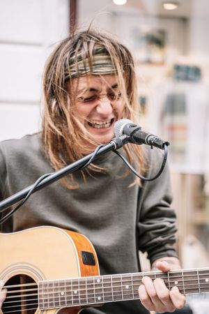 Male musician performing in the street