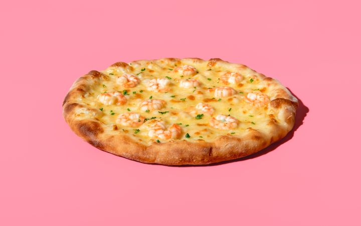 Shrimps pizza minimalist on a pink background