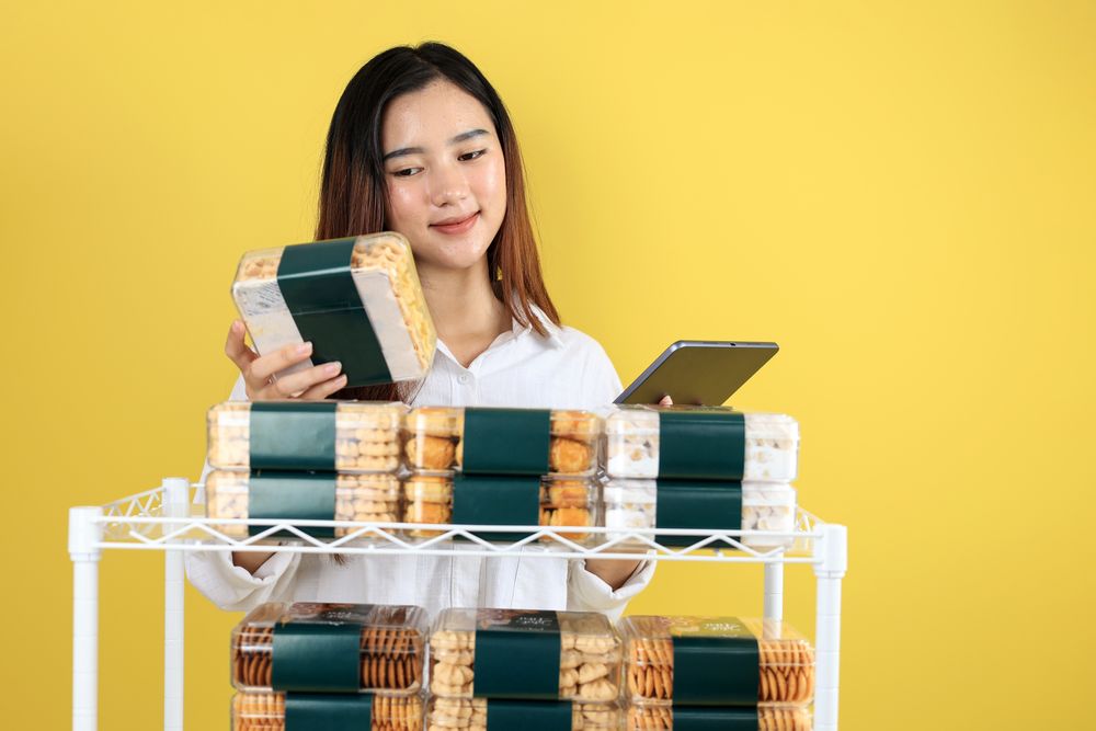 Asian Woman Business Bakery Owner Checking Stock Using Tablet