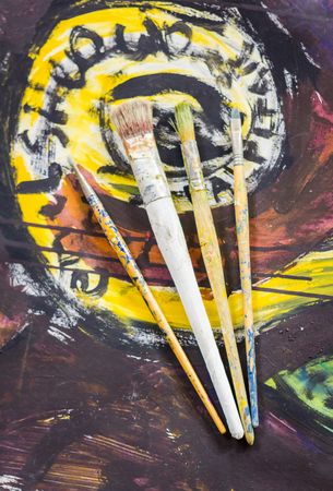 Set of paint brushes on oil painting