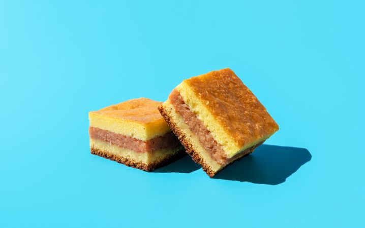 Slices of apple cake minimalist on a blue background