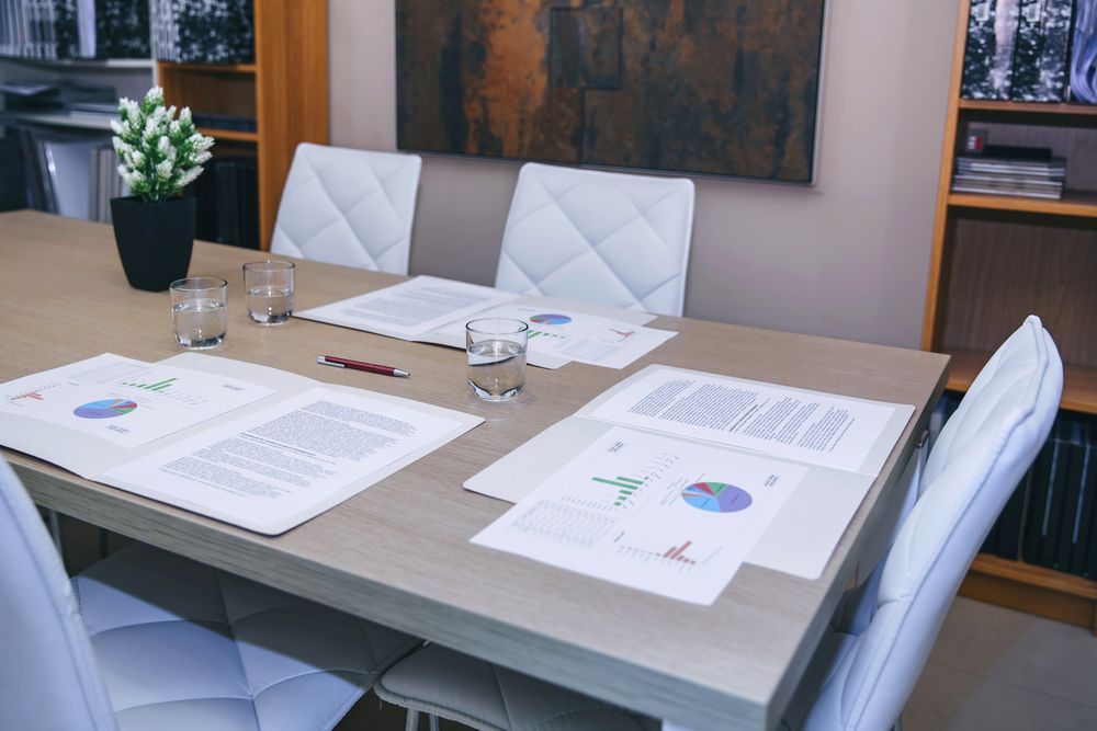 Desktop with graphs and diagrams in office