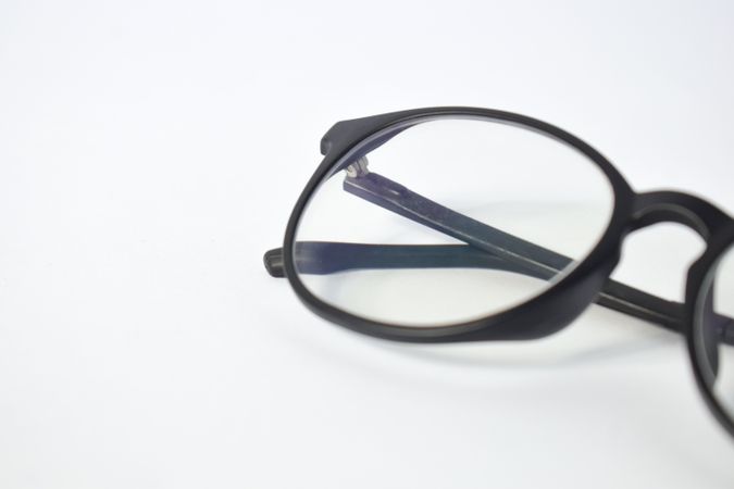 Close up of spectacles in plain studio background with copy space