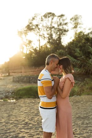 Happy couple looking at each other on beach